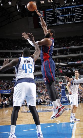 Andre Drummond shoots over DeJuan Blair of the Dallas Mavericks in Sunday's 116-106 loss. Drummond contributed a season-low four points and six rebounds in the game. (Photo courtesy of Glenn James/NBAE/Getty Images)