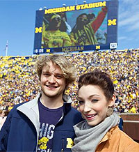 Meryl Davis and Charlie White being honored at a Michigan football game. (Courtesy of http://davis-white.ice-dance.com)